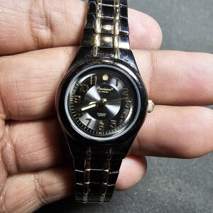 precision by gruen Ladies Quartz Fashiin Watch Black And Gold Tone Working shows